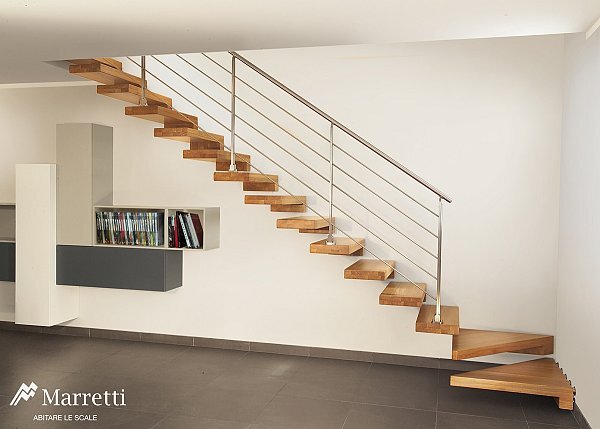 Scale dal look moderno e minimal che sono un estensione del muro stesso